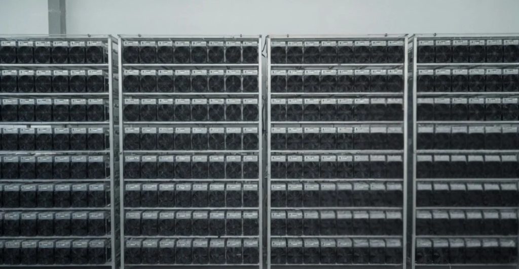 Neat racks of client-owned miners